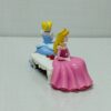 Cinderella figure and sleeping beauty sitting on the original bench