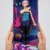 Zoey K-Pop Demon Hunters Doll عروسک زویی K-Pop Demon Hunters با موهای قرمز، لباس مشکی و دامن نارنجی داخل جعبه